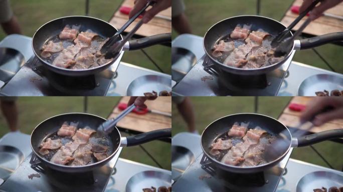 在野营炉子上做饭。