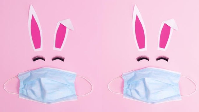 两个复活节兔子，面具在柔和的粉红色背景。停止运动
