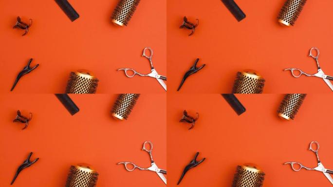 专业剪发剪梳子的定格动画，用于分离发夹部分发夹和金色圆形发刷，用于橙色造型。美发师沙龙设备