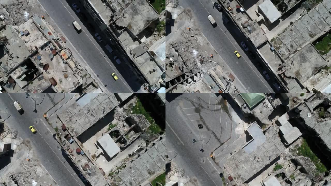无人机在阿勒颇街道上空飞行。我们可以看到街上开着卡车，车上有大约4千名乘客
