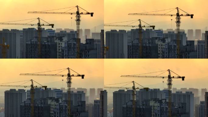 城市建筑塔吊清晨日出唯美长焦航拍