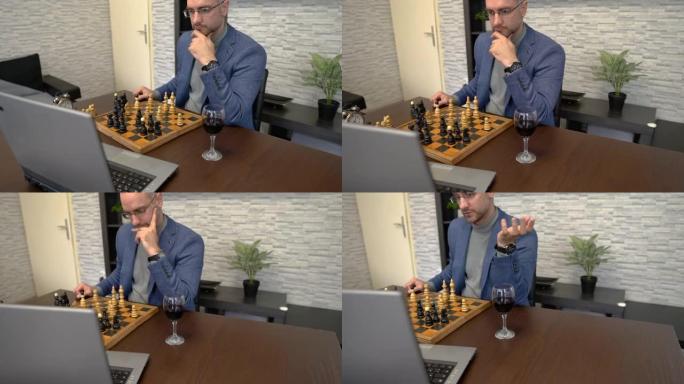 男人和他的朋友在电脑上下棋