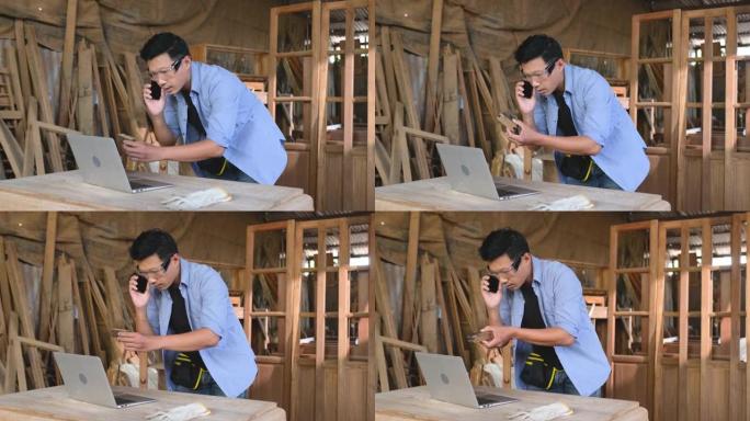 亚洲木匠或工匠通过手机与客户交谈并展示木制品