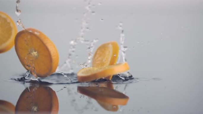 圆形的新鲜橙片在慢动作中掉落