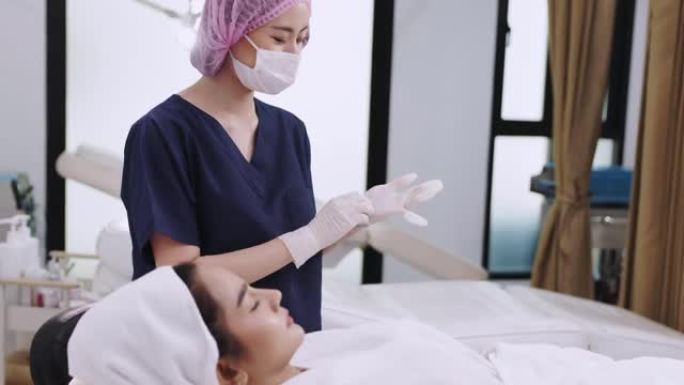 亚洲女性美容师在PRP吸血鬼整容期间向患者注射血浆。