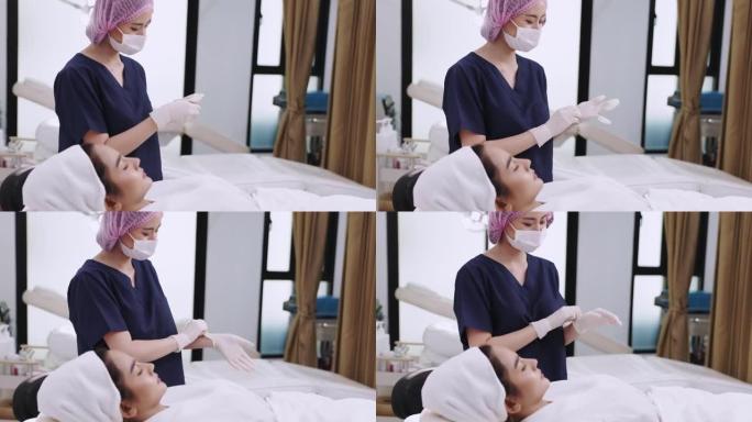 亚洲女性美容师在PRP吸血鬼整容期间向患者注射血浆。