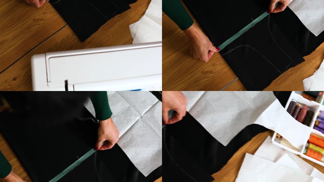 一步一步，女裁缝女在桌子上测量缝纫图案
