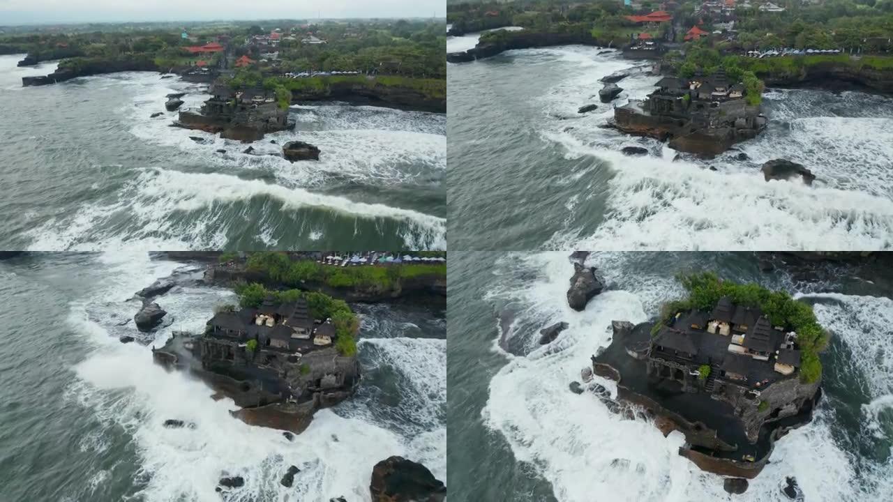 危险海中丹那罗得寺的全景。印度尼西亚巴厘岛著名旅游胜地周围的强烈海浪坠入岩石