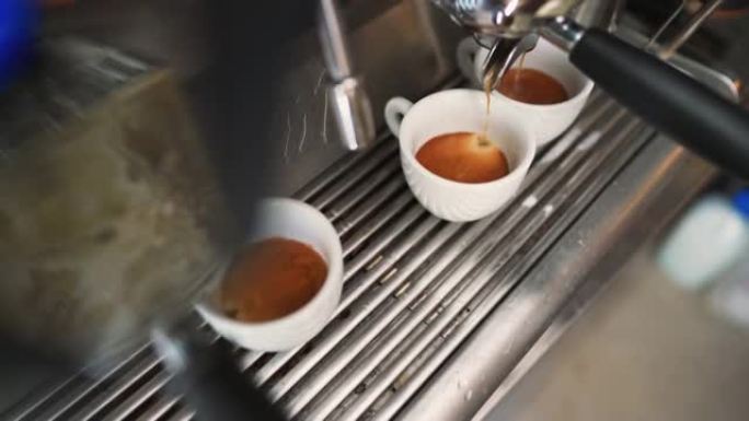 浓缩咖啡机将咖啡倒入杯子
