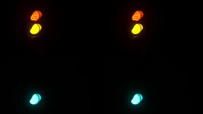 交通灯在晚上从红色切换到绿色