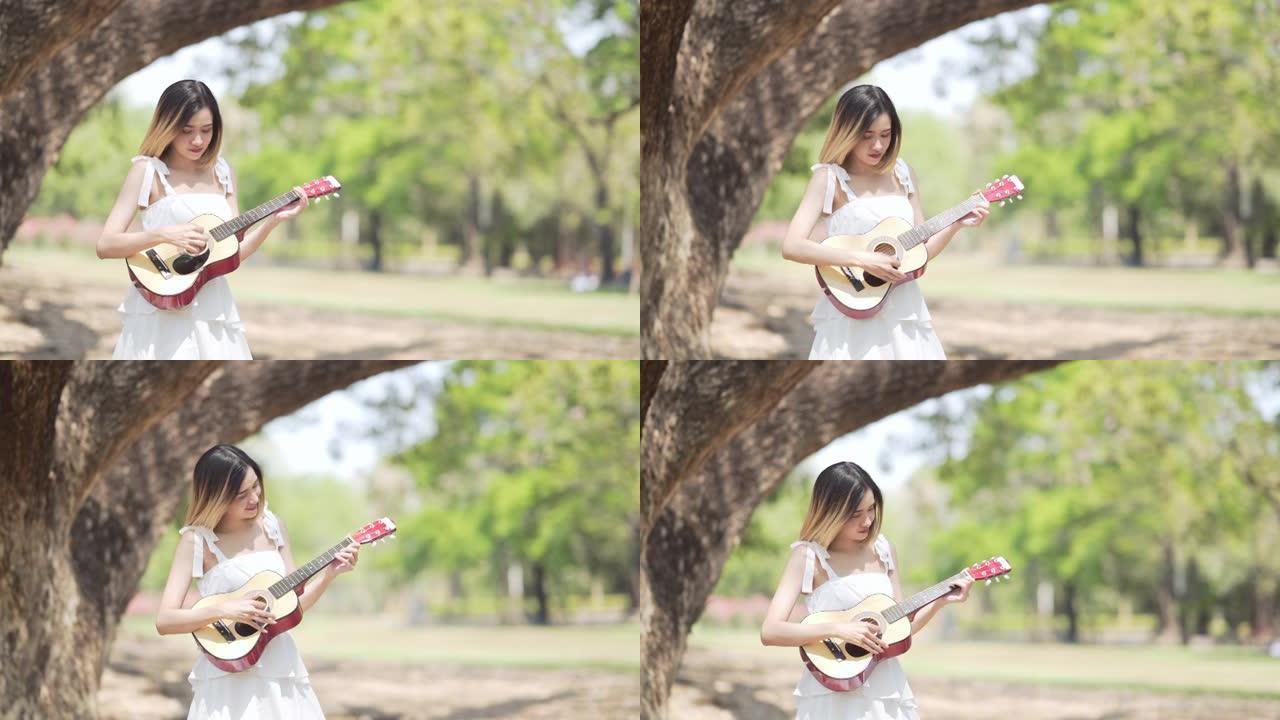 亚洲少女学习吉他