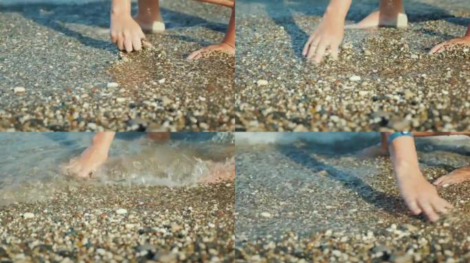 一个人在海边的海浪中收集美丽的鹅卵石