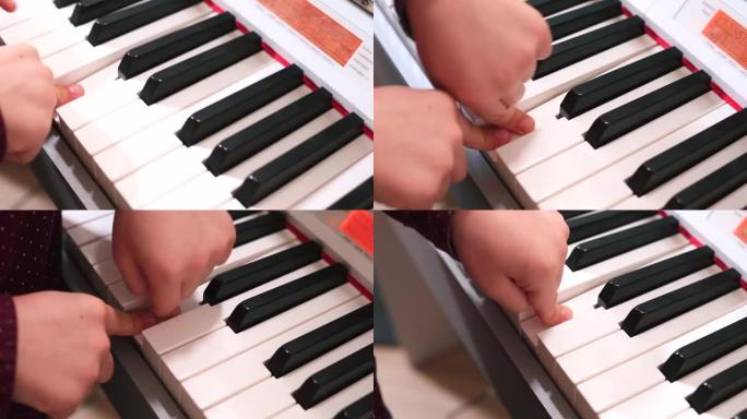 钢琴发展耳朵在儿童音乐中，手指按住一个音符。