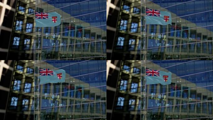 摩天大楼上飘扬的斐济国旗