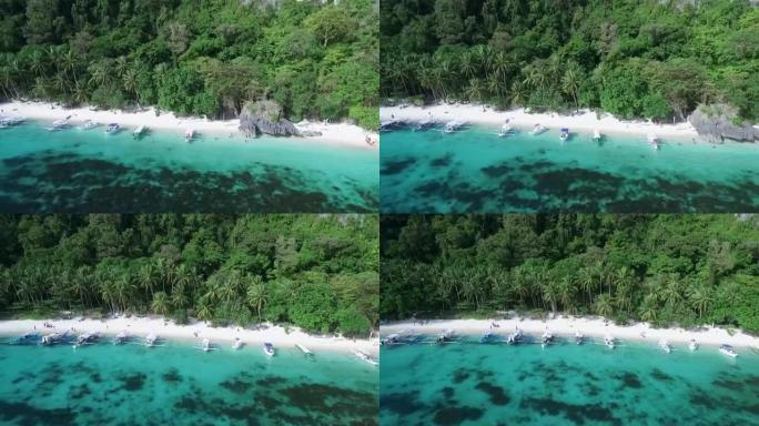 巴拉望的木瓜海滩，观光的地方。在菲律宾爱妮岛巡回演出。宁静的白色沙滩，清澈的绿松石水，背景中的棕榈树