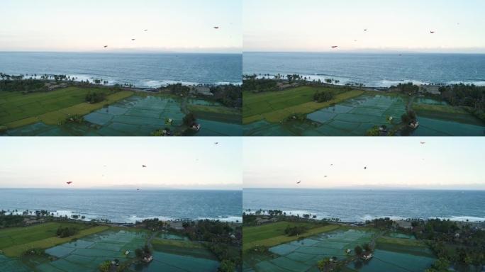 风筝在海洋鸟瞰图附近飞翔。