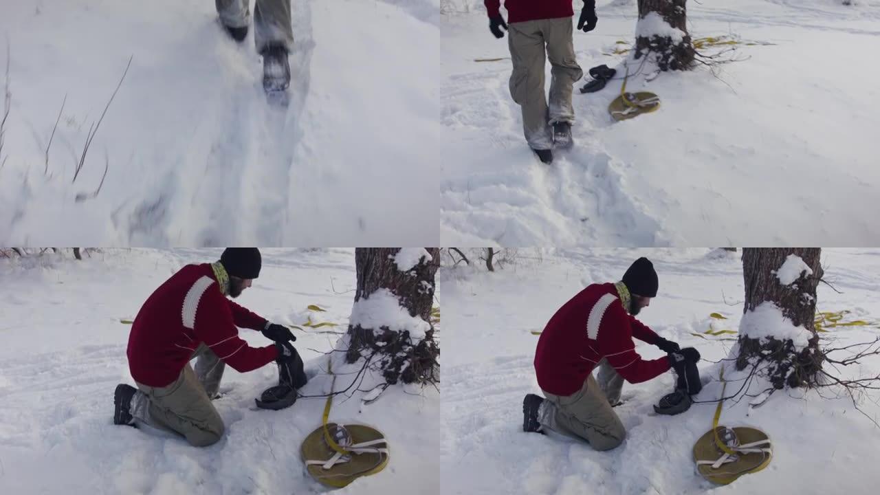 高加索人在冬季森林的树木之间设置松懈线。一个男人在冬天练习高脚板。