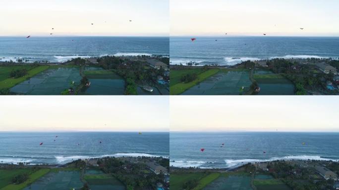 许多风筝在海洋鸟瞰图附近飞翔