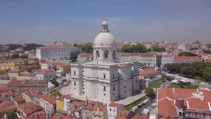 阳光灿烂的里斯本城市景观教堂圣昂格朗西亚顶级空中全景4k葡萄牙