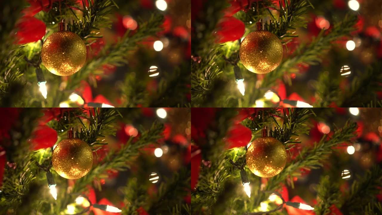 圣诞闪光红色和绿色金色装饰品挂在照明树上特写动作镜头