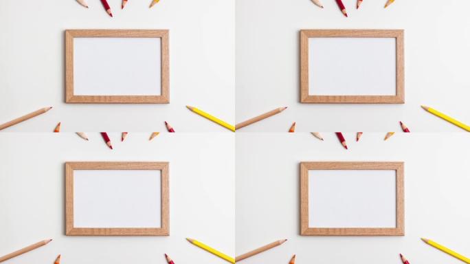 白色背景上的黄色红色铅笔和木制框架。停止运动动画平面俯视图。带复制空间的教育返校和在线学习概念