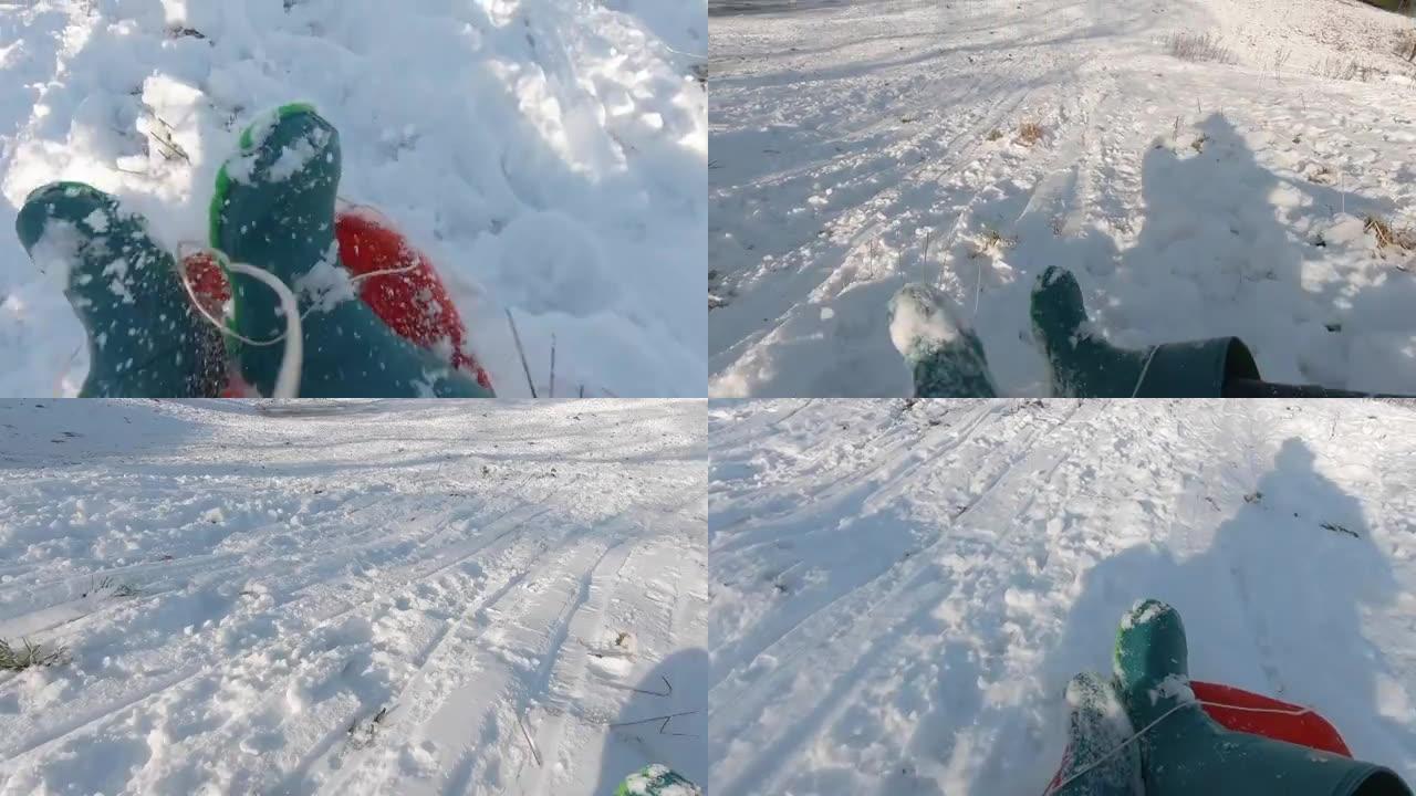 一个小男孩在新鲜的雪中滑下雪山的镜头