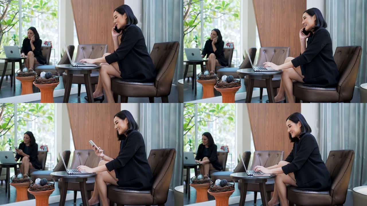 亚洲商务女性在明亮的休息区使用笔记本电脑。