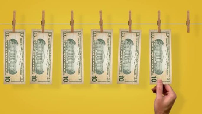 10美元的洗钱线输送机，黄色背景上10美元钞票的背面