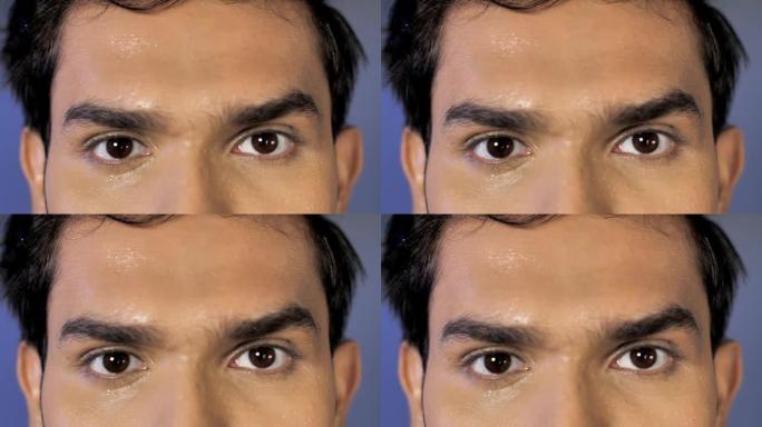 男性的眼睛和前额的极端特写镜头，汗滴活跃的生活方式