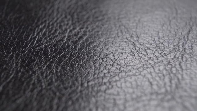 皮革黑色表面的皱纹抽象纹理