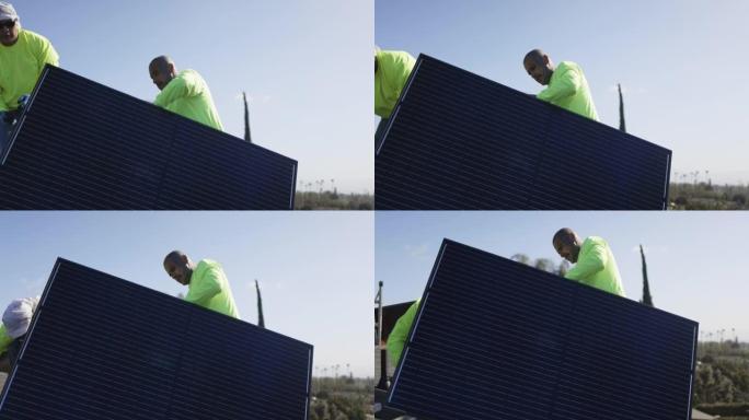 在加利福尼亚州的住宅屋顶上安装太阳能电池板的工人团队