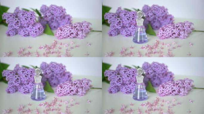 玻璃瓶香水美丽的花丁香，花瓣的丁香，香水，香味，花，香气，背景，美丽