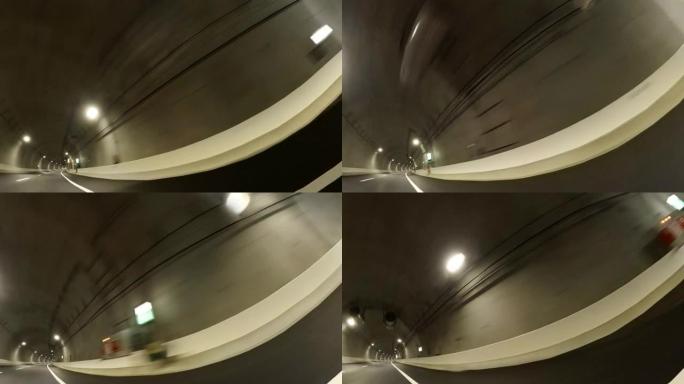 在公路隧道上行驶/从汽车拍摄的后方和侧视图。