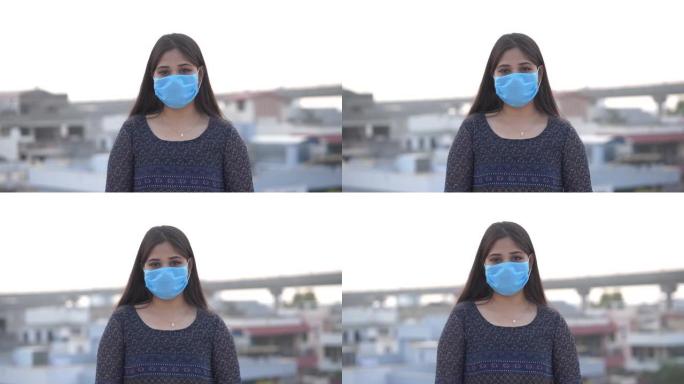 年轻的亚洲妇女戴着口罩对抗科罗娜病毒。