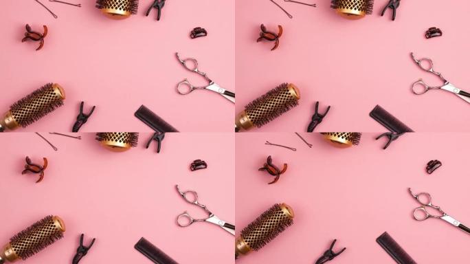 专业剪发剪梳子的定格动画，用于分离发夹部分发夹和金色圆形发刷，用于粉红色着色造型。美发师沙龙设备