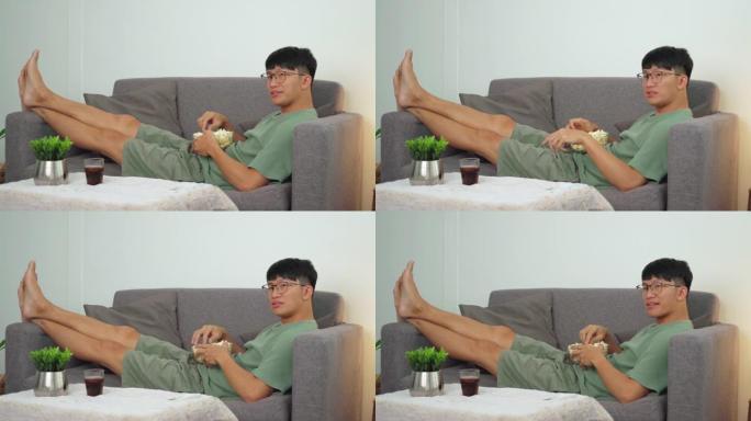 4k video footage of Asian Man is watching TV comed