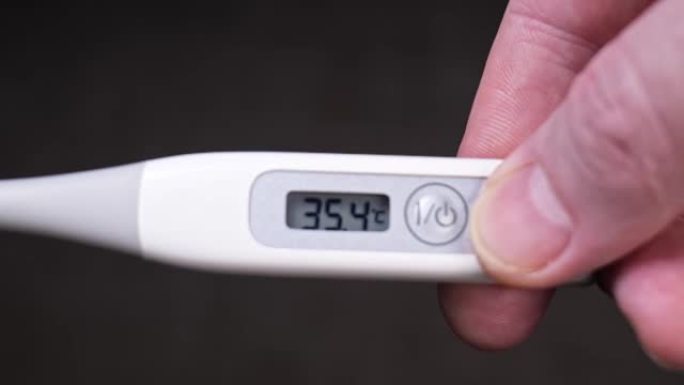 温度计特写。新型冠状病毒肺炎温度测量