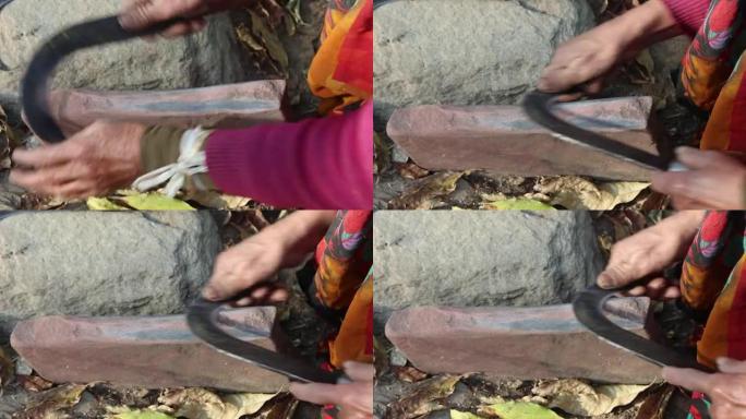 印度乡村妇女用石头磨手镰刀 (木材切割工具) 刀片