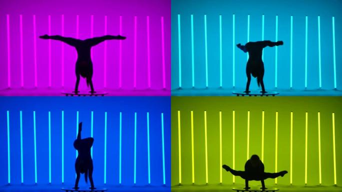 一个女人站在她的手上劈开，伸展她的腿，弯曲它们，以折叠姿势坐着。以彩色霓虹灯为背景的体操运动员。深色