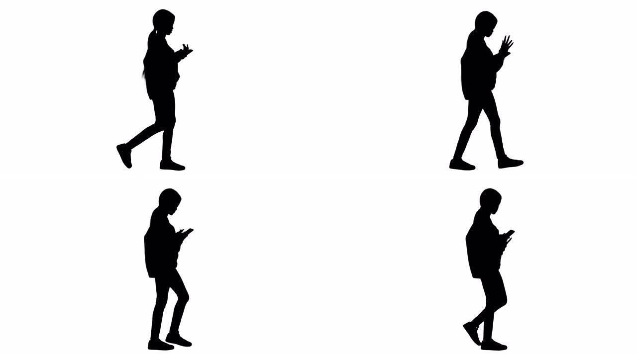 微笑的女人在走路时在手机上输入短信，Alpha频道