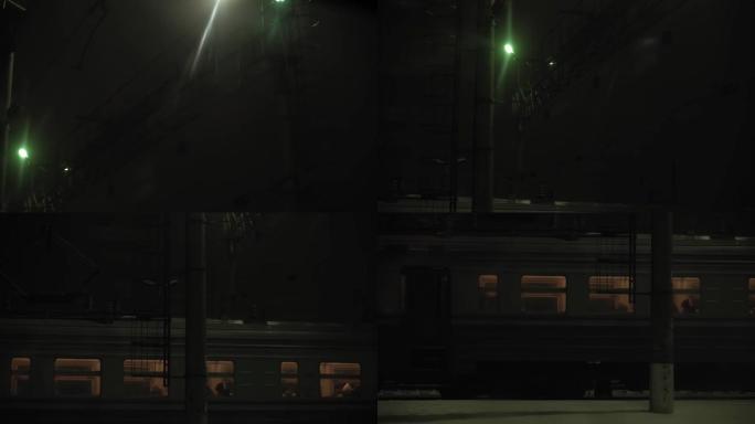 交通、公路、铁路、景观、交通、概念 -- 夜幕下在火车站上车的人的窗口视图。在下雪的冬天乘火车在乡村