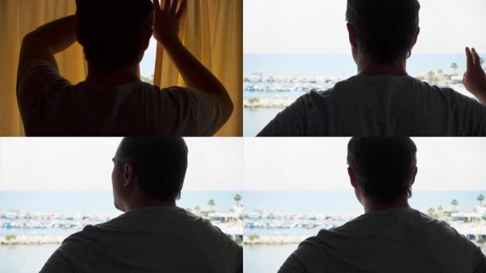 男人打开窗帘的轮廓，从露台上欣赏海景。男性旅行者看着码头
