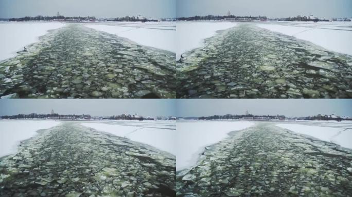 裂开的冰的鸟瞰图。全球变暖，气候变化冬季