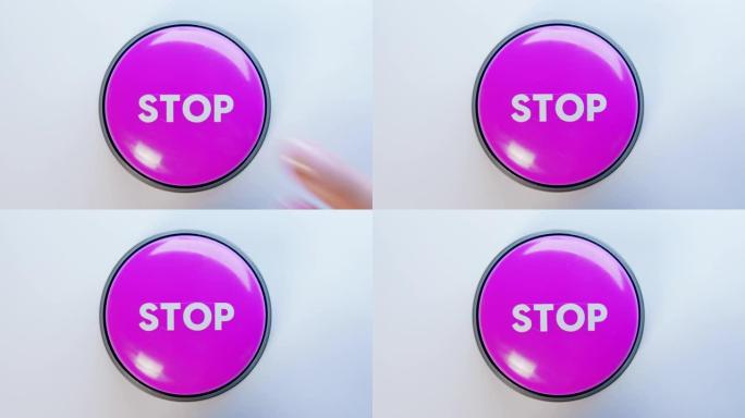 女人按了停止键，特写。按下手指按钮来暂停一个动作或过程。紧急停车标志，安全关闭电源。电源按钮在白色背