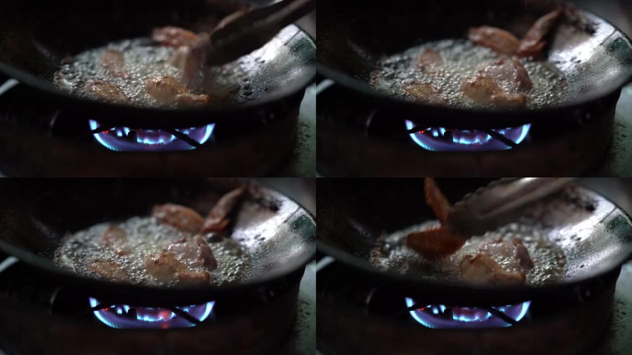 在锅上用热油烹饪checken