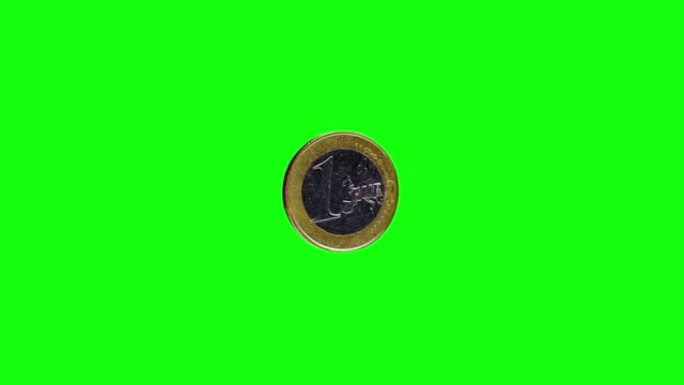 绿色背景上有罗纹一面的闪亮一欧元硬币