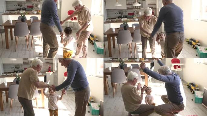 蹒跚学步的孩子和他的祖父母在家里的客厅地板上玩耍，享受快乐的时光