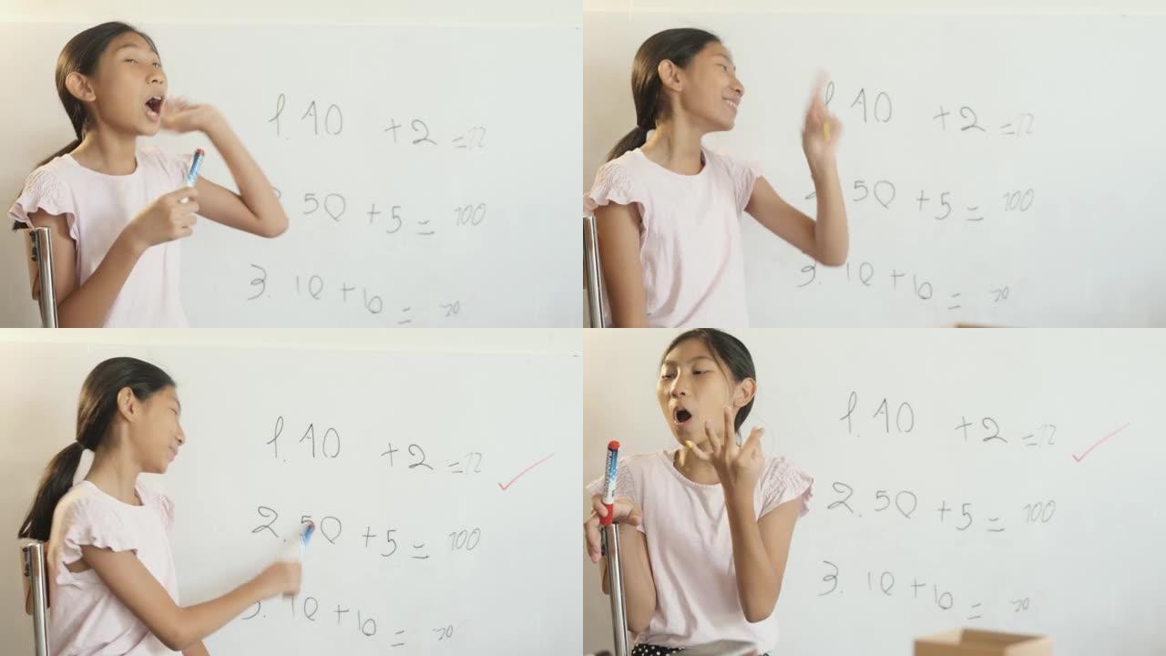 快乐的亚洲女孩在家上学期间在白板上为姐姐教数学科目，呆在家里的概念。