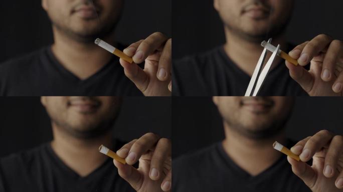 一个年轻人用剪刀将香烟切成两根。为了身体健康，他想戒烟。世界烟草日