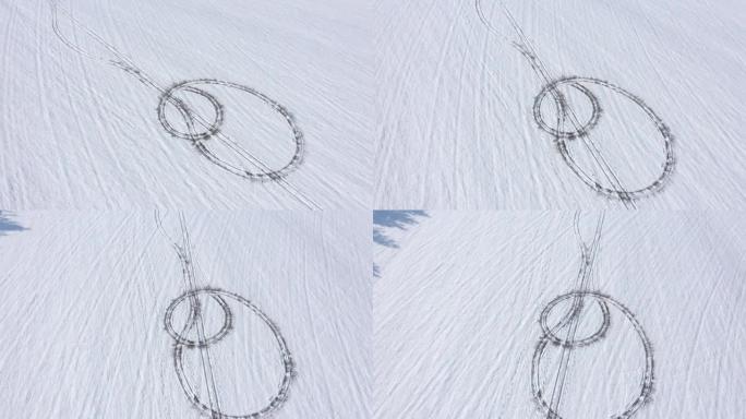 在下雪的山上飞行，轮胎步道4k无人机视频